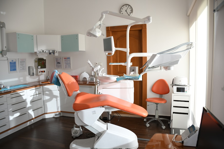 Dental clinic interior with orange chairs